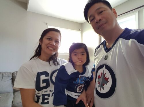 Girl with Cornelia de Lange syndrome and her parents